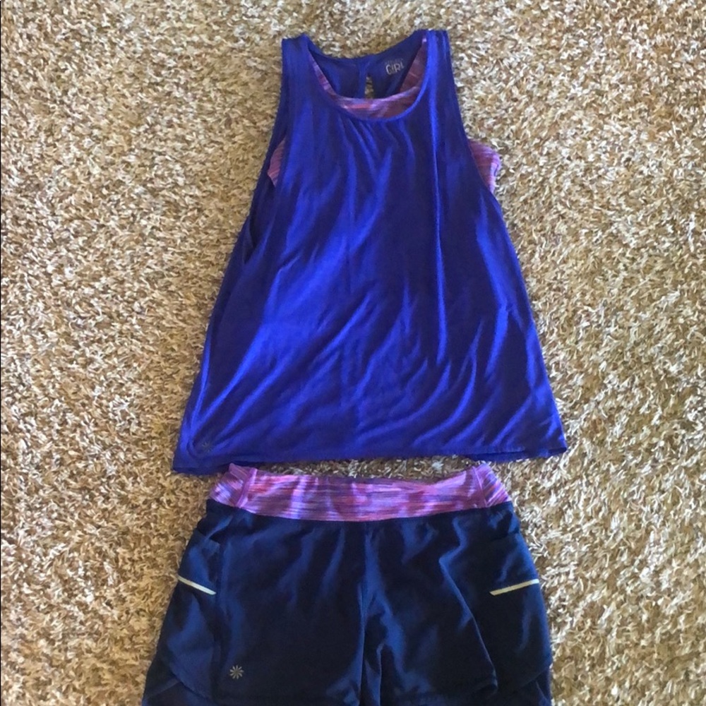 Matching blue and purple Athleta tank and shorts